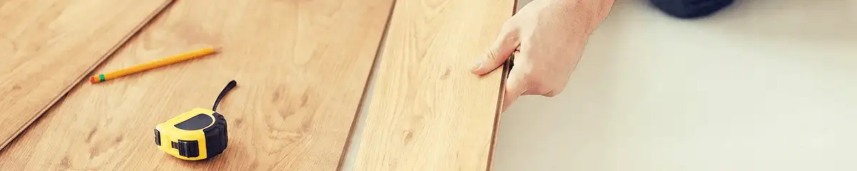A professional installing wood flooring in Columbia, SC