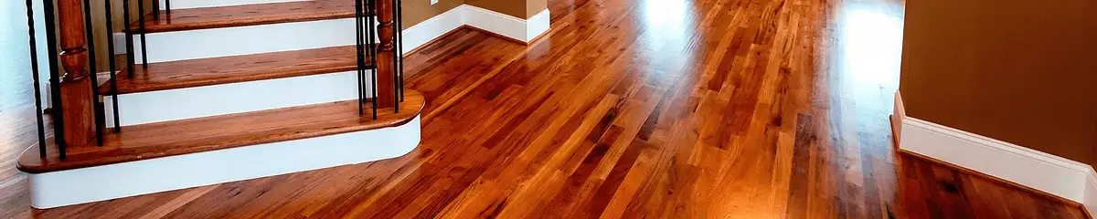 Base floor of a staircase with professionally restored wood flooring in Columbia SC