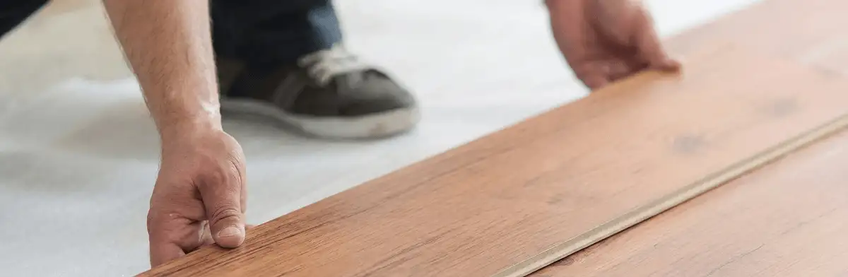 A professional installing laminate flooring in Columbia, SC